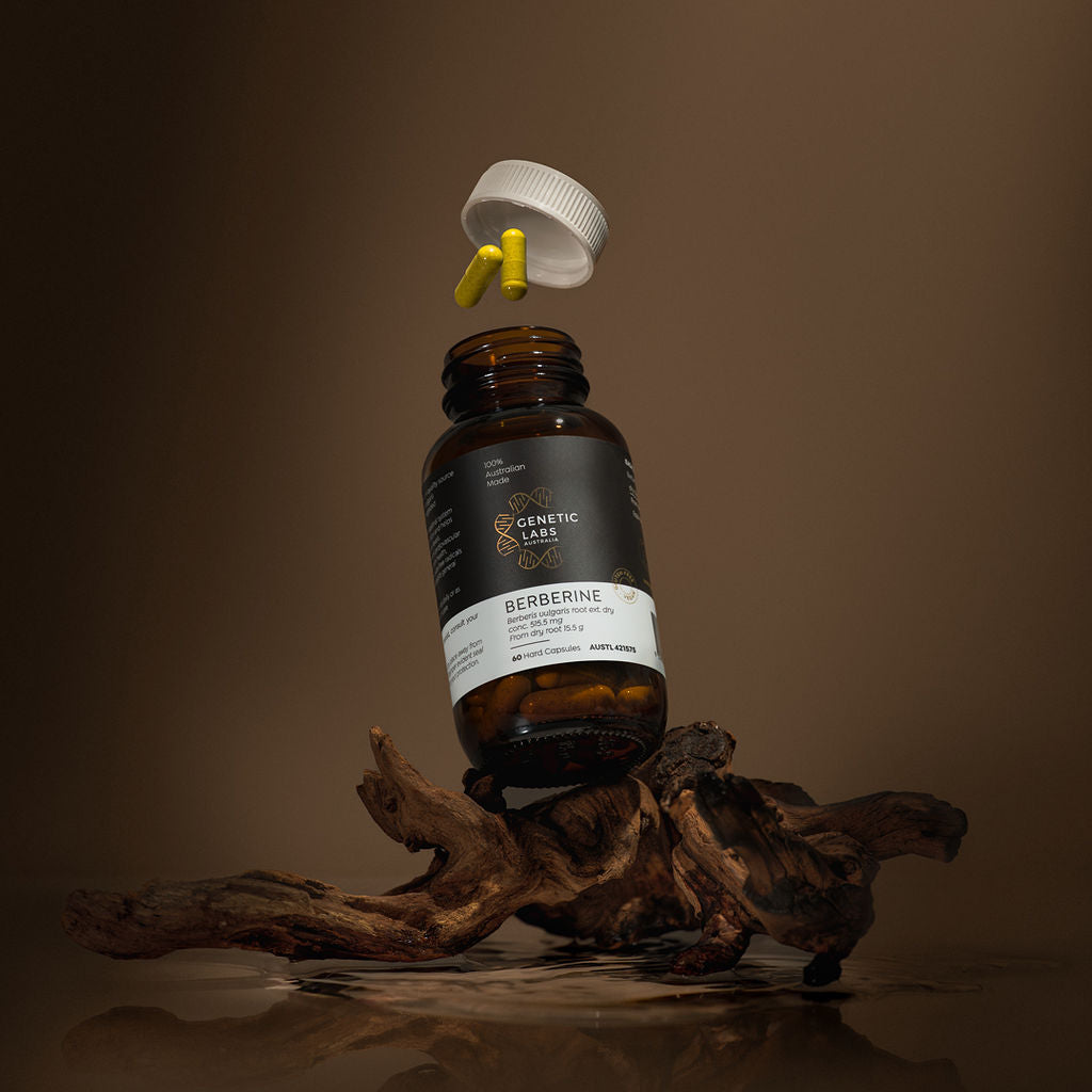 Bottle of berberine supplement with dropper on a brown background